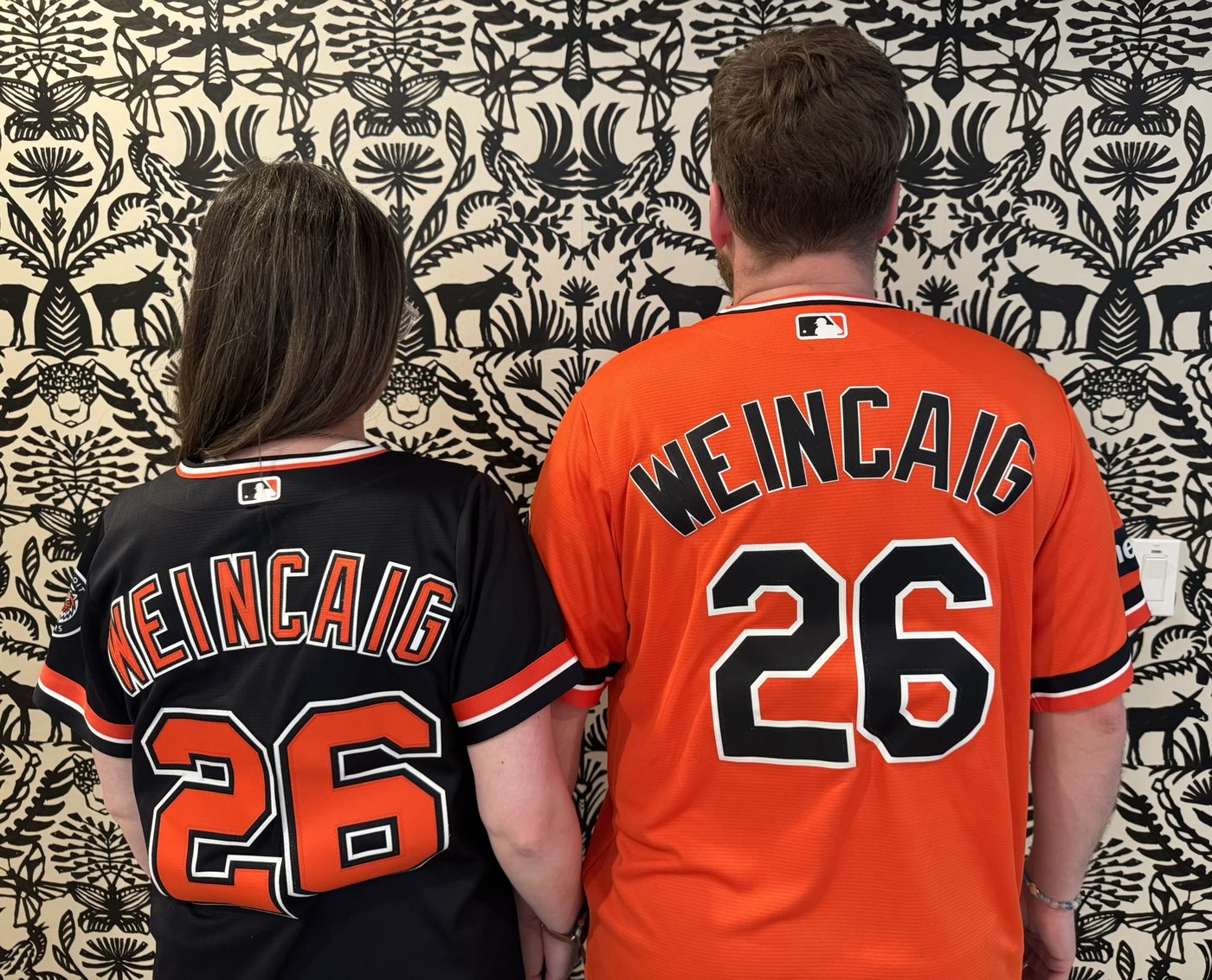 Erica and Adam in matching WEINCAIG #26 jerseys