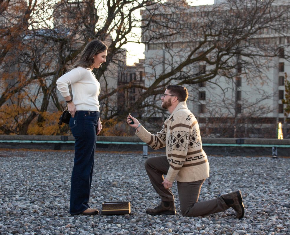 Adam proposing on the rooftop